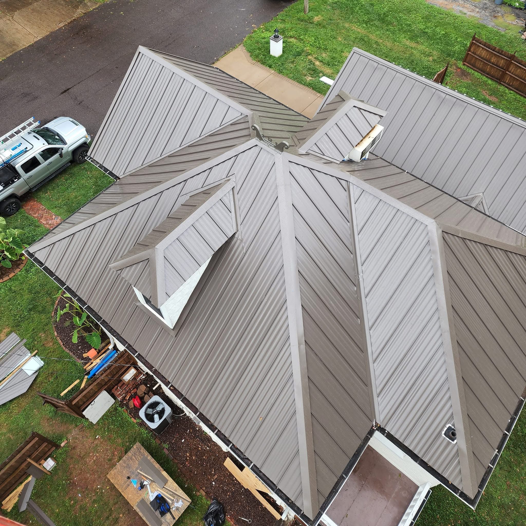 Intricate Standing Seam Metal Roof Installation on a Multi-Gable Home